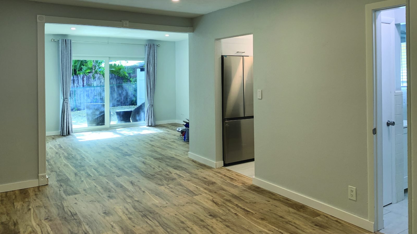 Renovated living room with sliding glass door
